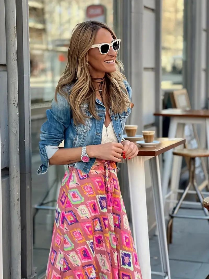 Long women's tiered maxi skirt, an essential flowing boho summer fashion piece.