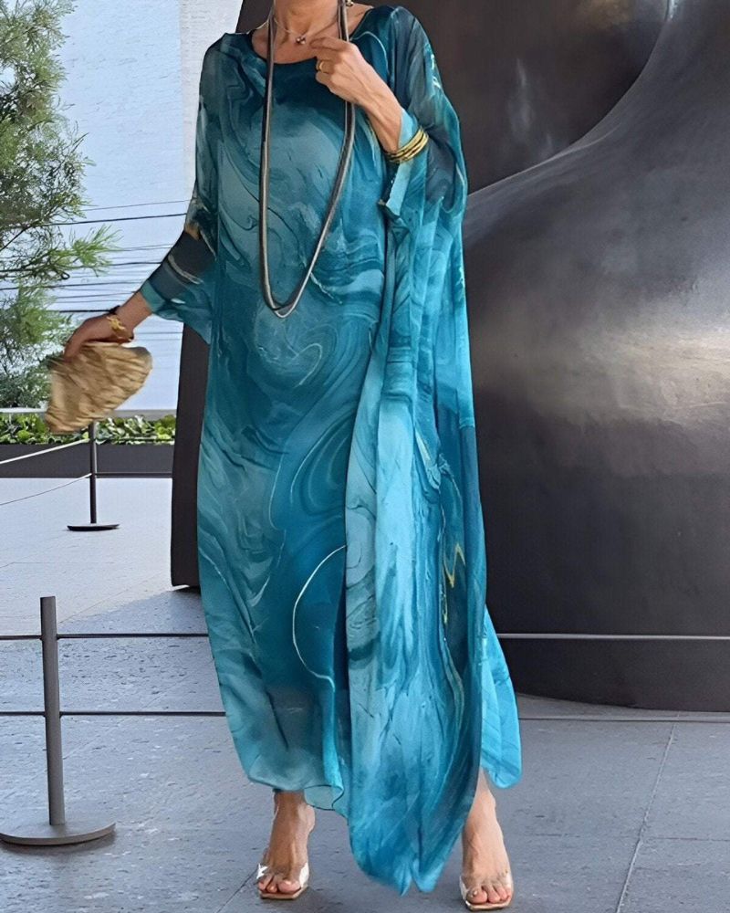 Women's flowy elegant maxi dress, perfect for summer occasions. Comfortable long design.