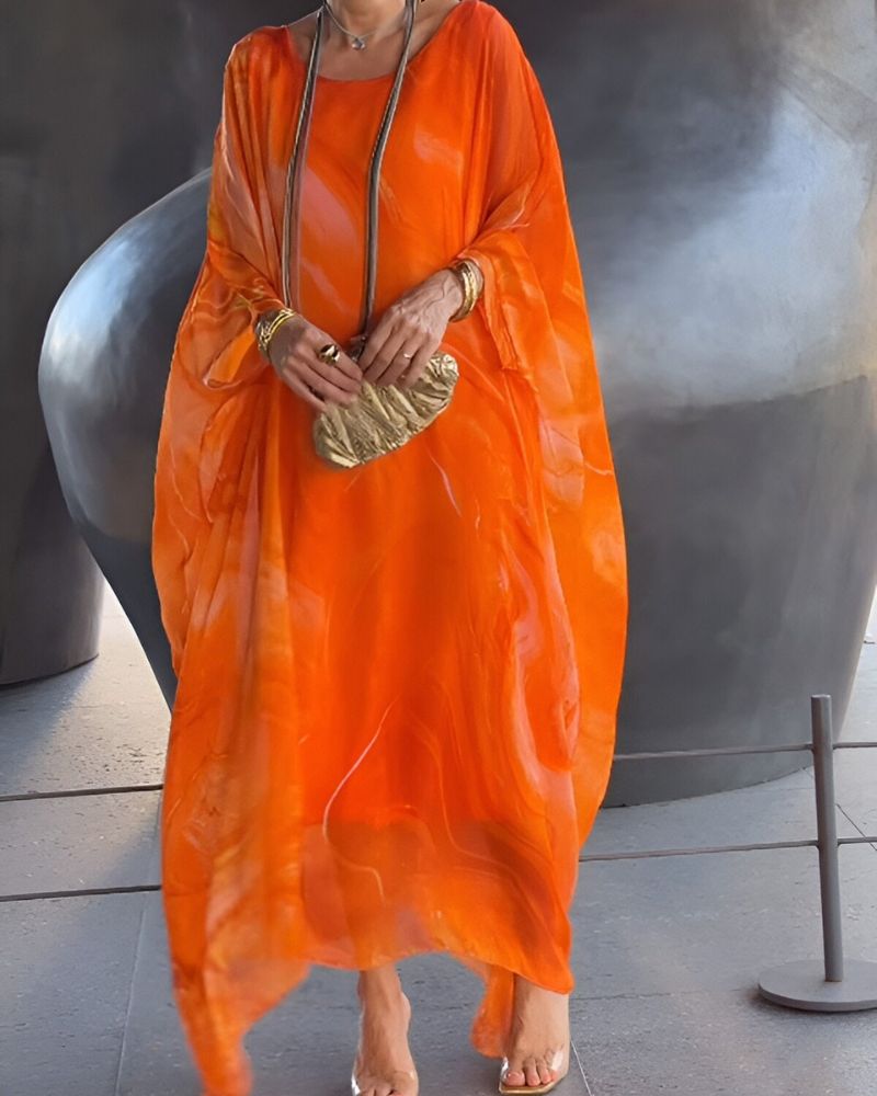 Stylish women's flowy maxi dress in a long design, great for summer parties and elegant wear.