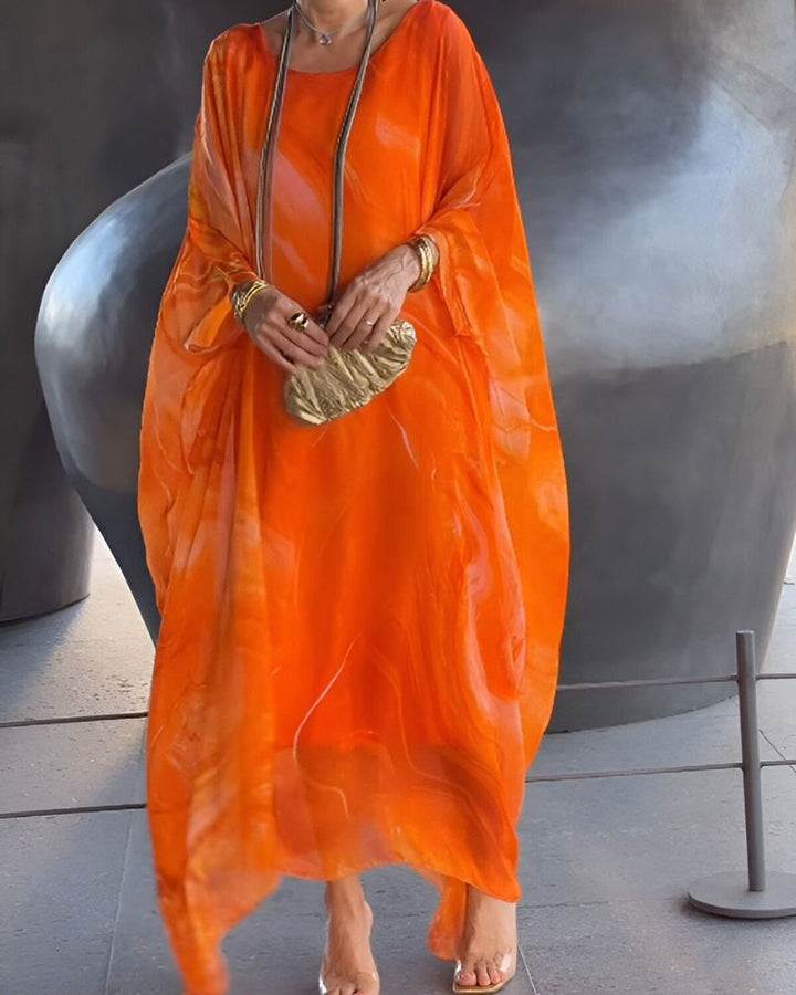 Stylish women's flowy maxi dress in a long design, great for summer parties and elegant wear.