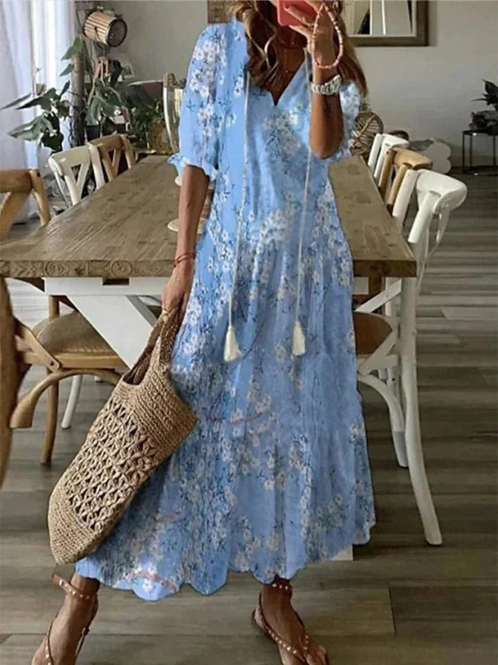 Elegant flowing women's maxi dress, bohemian V-neck style, featuring a beautiful leaf & stripe print.