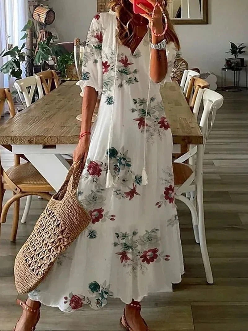 Women's V-neck long boho dress, flowing A-line silhouette, unique leaf & stripe pattern for a chic look.
