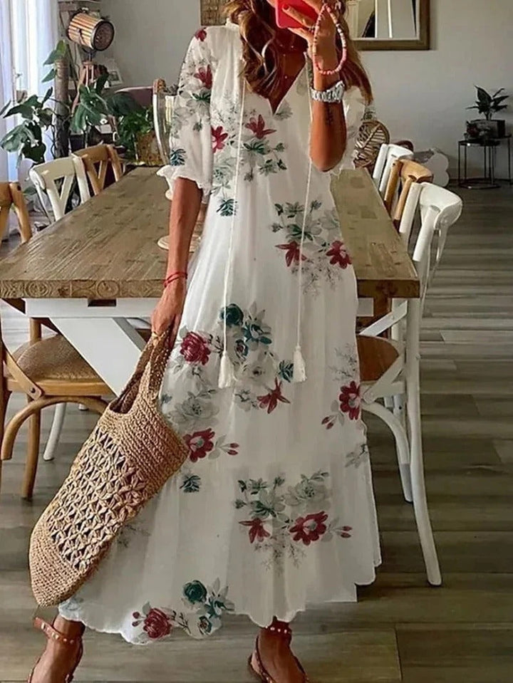 Women's V-neck long boho dress, flowing A-line silhouette, unique leaf & stripe pattern for a chic look.