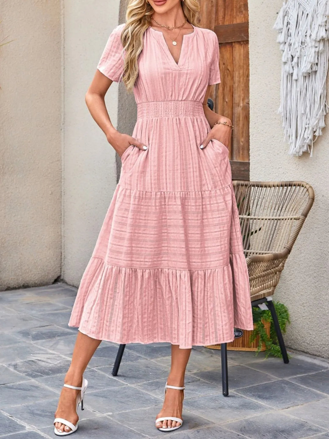 Women's flowy midi dress with practical pockets, ideal for casual summer wear.