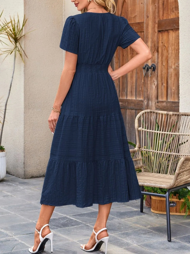 Versatile A-line midi dress for women, perfect casual or elegant look, with pockets.