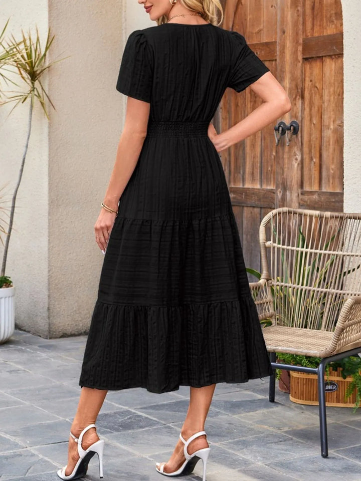 Women's fashion A-line dress, midi length, with essential pockets & flowy design.