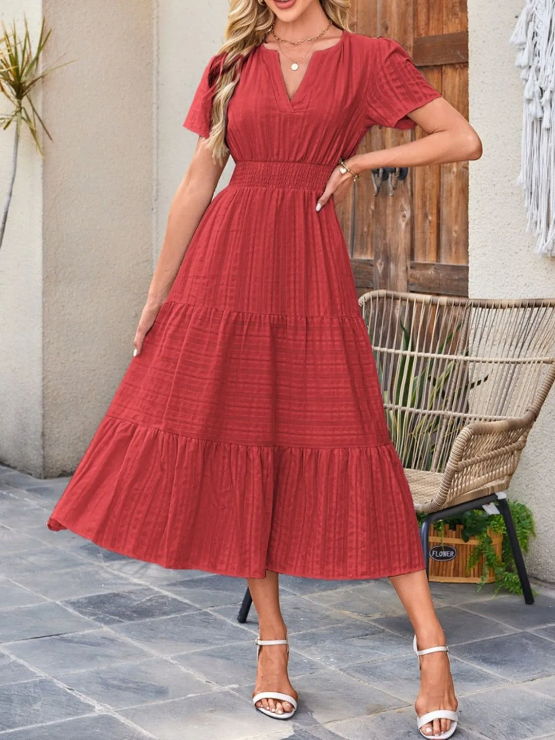 Women's short sleeve midi dress with pockets, A-line silhouette, perfect for any occasion.