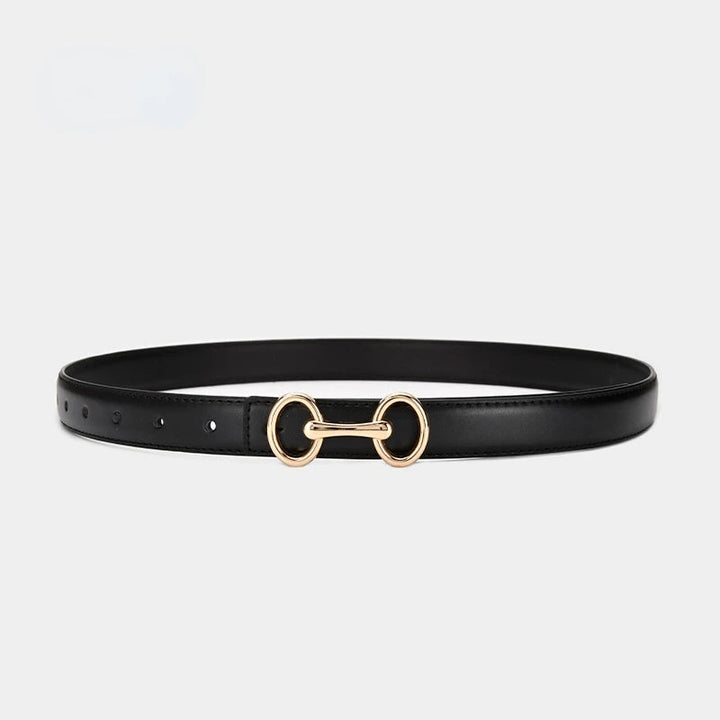 Elegant women's leather dress belt with a decorative Celtic charm buckle, ideal for both casual and formal wear.