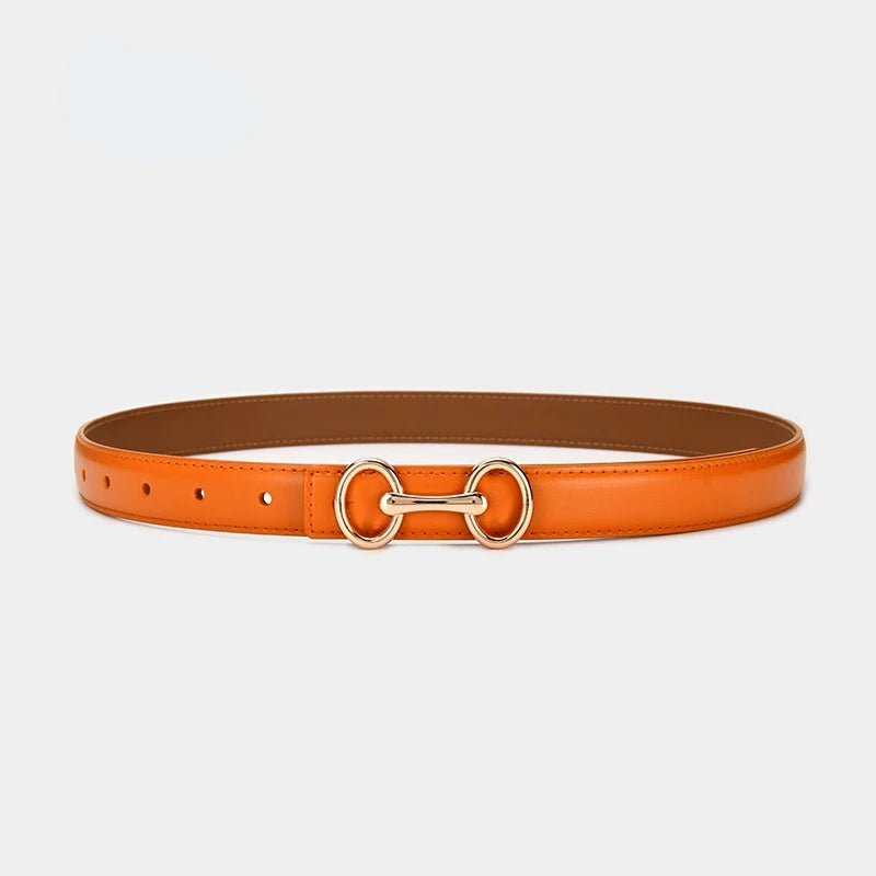 Chic women's leather accent belt featuring an antique silver-tone Celtic charm buckle, a versatile fashion accessory.