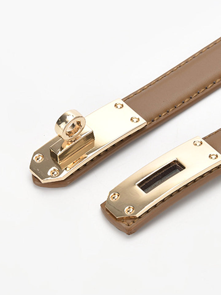 Elegant gold twist buckle waist belt for women, enhancing any chic outfit.