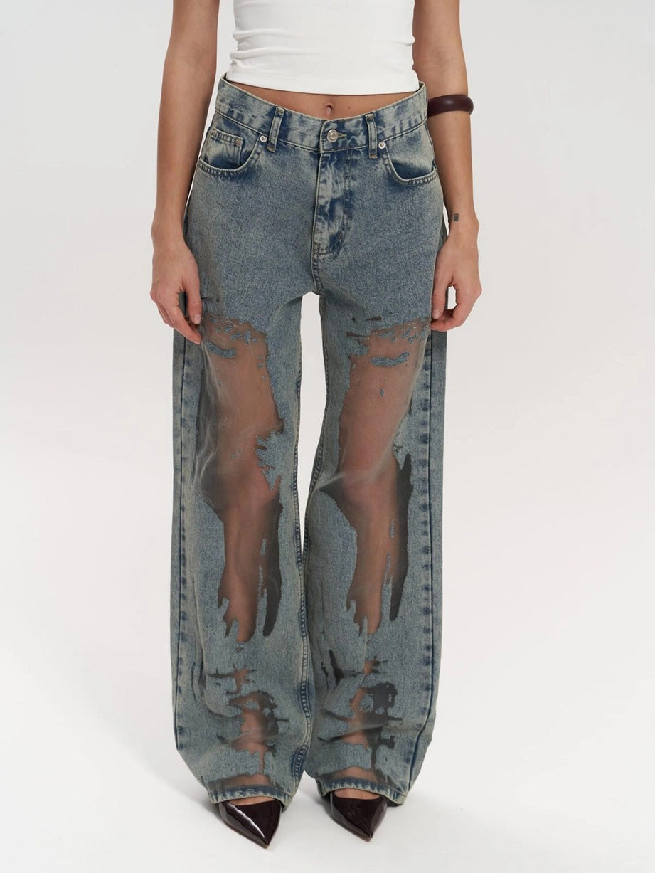 Women's high waist wide leg jeans with unique mesh panel detailing. Trendy denim bottoms for an edgy style.