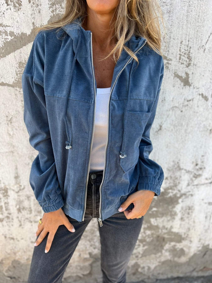 Fashionable women's loose-fit hooded jacket, offering ultimate comfort and effortless street style for everyday wear.