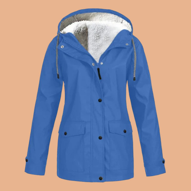 Woman walking comfortably in a stylish hooded mid-length women's winter jacket.