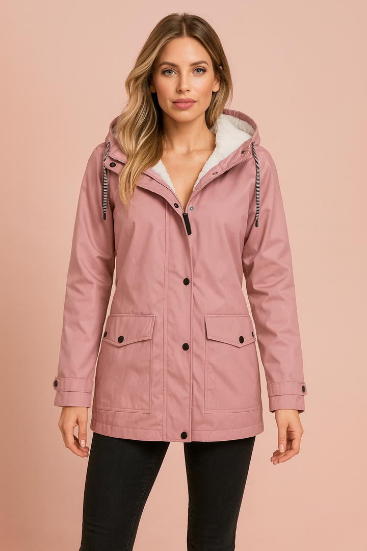 Side view of a mid-length women's utility winter jacket, functional design for outdoor adventures.