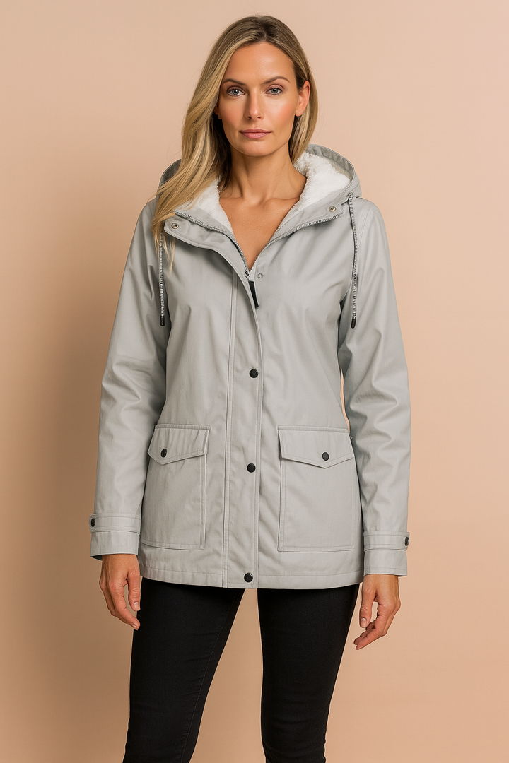 Woman in a casual hooded mid-length utility winter jacket, ideal for daily warmth & style.