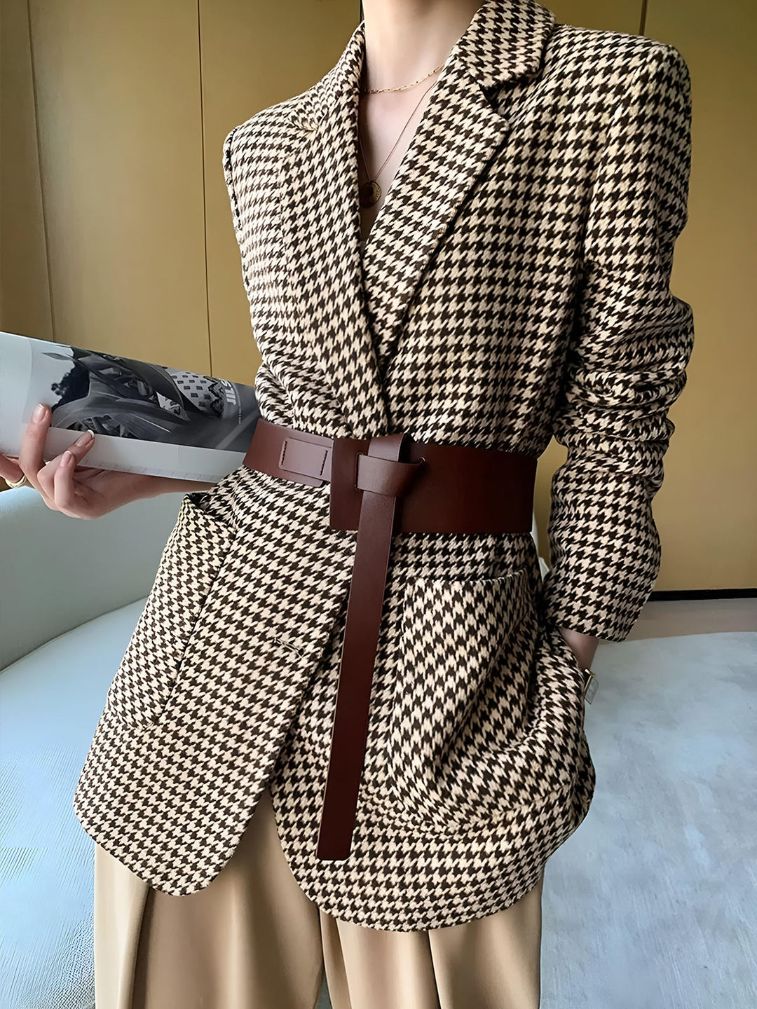 Chic women's houndstooth blazer, belted for a tailored look. Ideal professional or contemporary office wear.