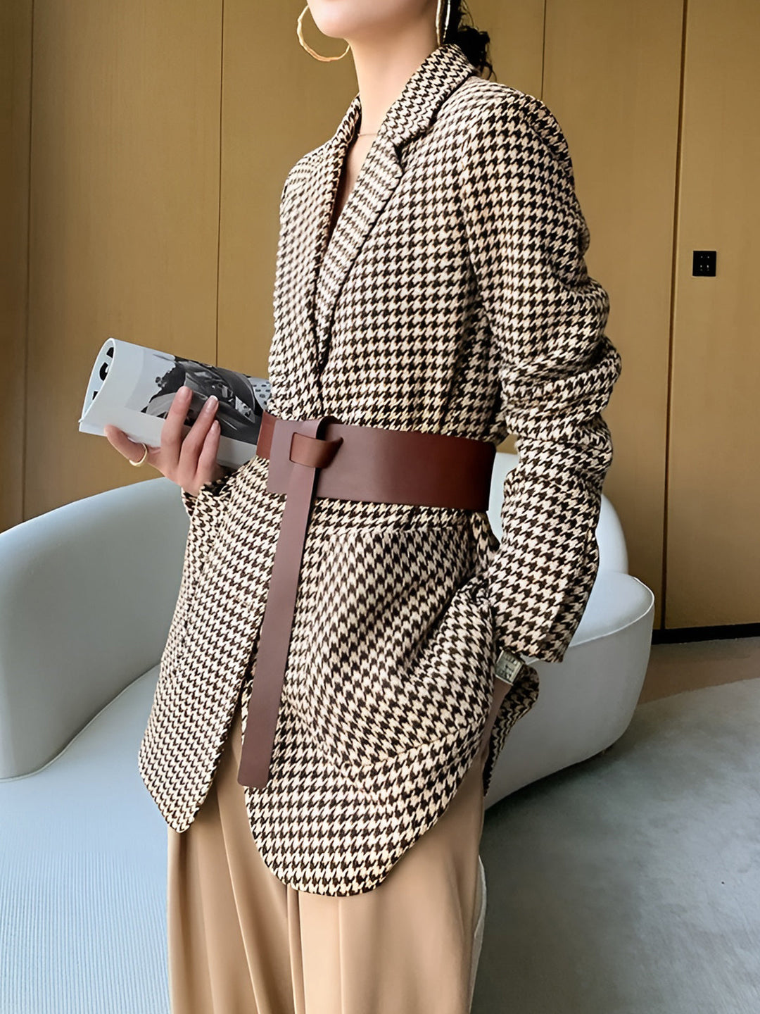 Contemporary women's belted blazer with unique split-hem. Houndstooth pattern, perfect for a chic look.