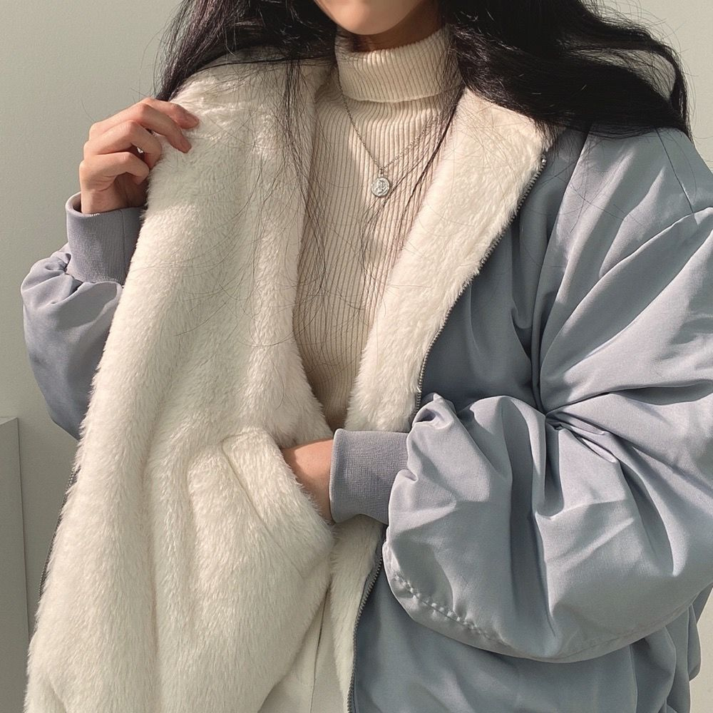Women's Isla reversible winter jacket with hood, ideal warm outerwear for versatile fall and winter fashion.