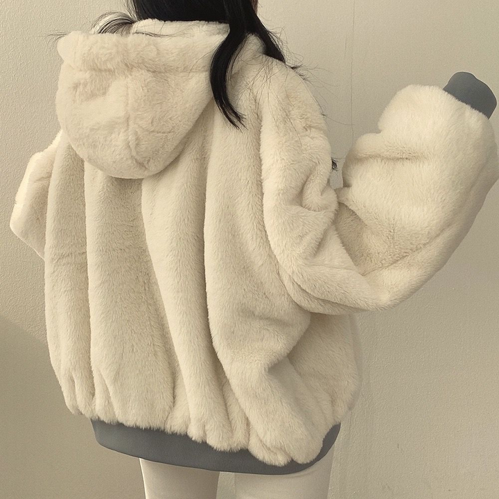 Modern women's reversible winter coat, Isla, hooded and warm, great for travel and casual winter outfits.