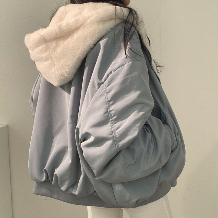 Warm Isla women's jacket, reversible and hooded, a cozy winter coat for everyday style and travel.