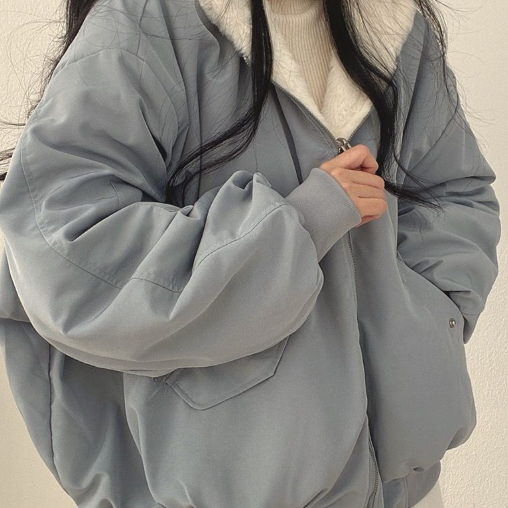 Versatile women's reversible winter jacket, the Isla hooded outerwear provides warmth for fall fashion.