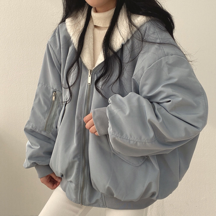 Chic women's reversible hooded winter coat, Isla, designed as warm, versatile outerwear for chilly weather.