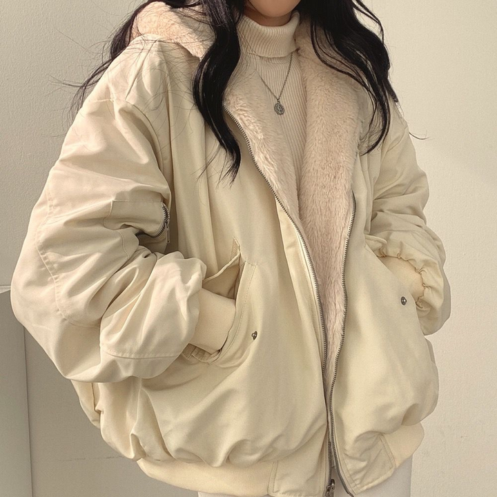 Isla women's reversible winter jacket, a practical hooded coat for travel and everyday fall/winter wear.