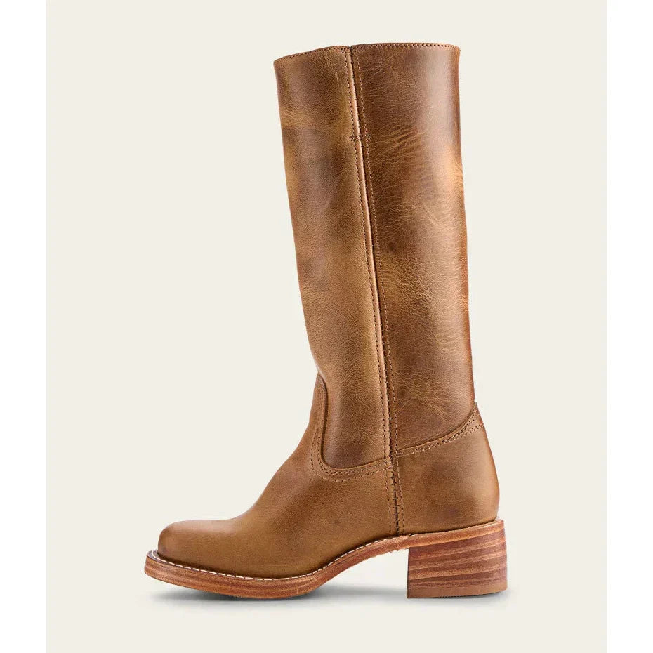 Close-up of women's knee-high cowboy boots, emphasizing quality and stylish western footwear details.