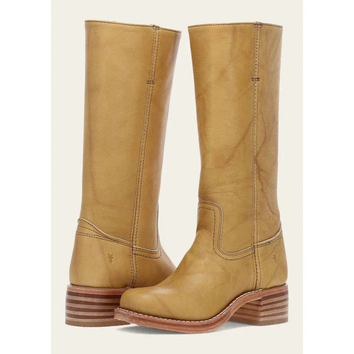 Women's knee-high cowboy boots, completing a stylish western-inspired outfit with tall boot flair.