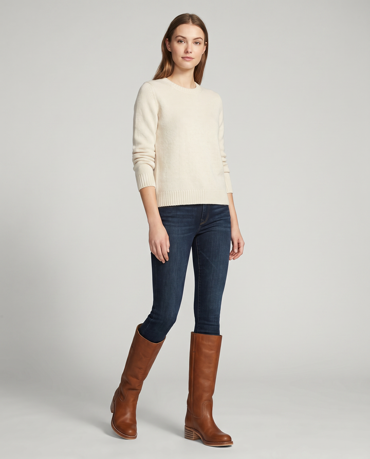 Stylish brown women's knee-high cowboy boots, essential western footwear with a comfortable block heel.