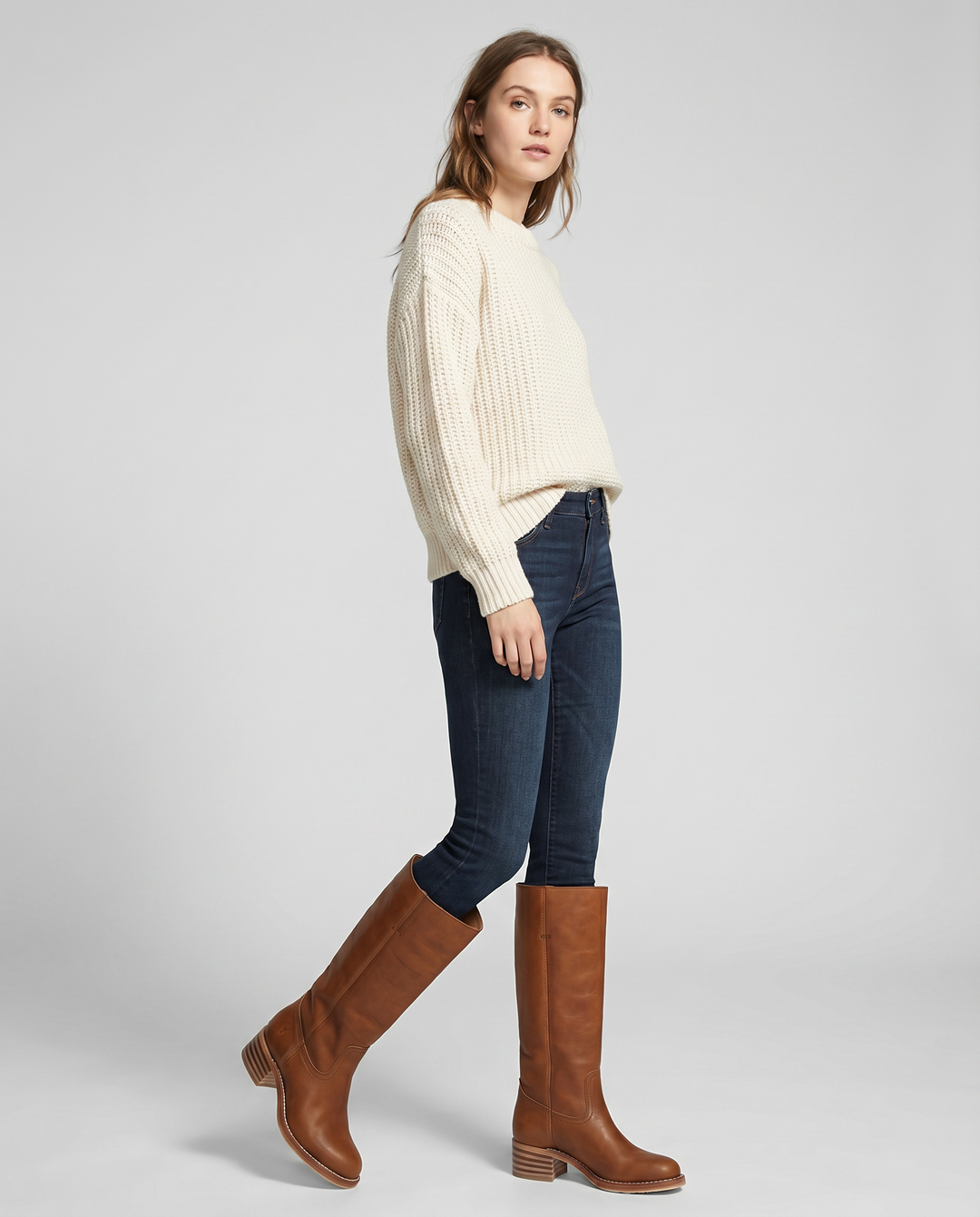 Elegant beige women's knee-high cowboy boots, all-season western style with a sturdy block heel.