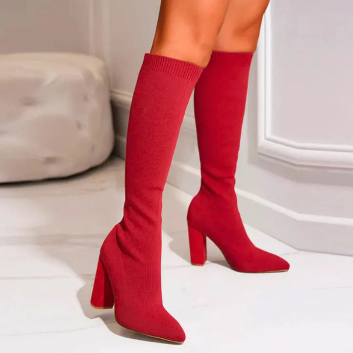 Modern block heel women's knee-high boots. Stretch tall boots offering stylish and versatile appeal.