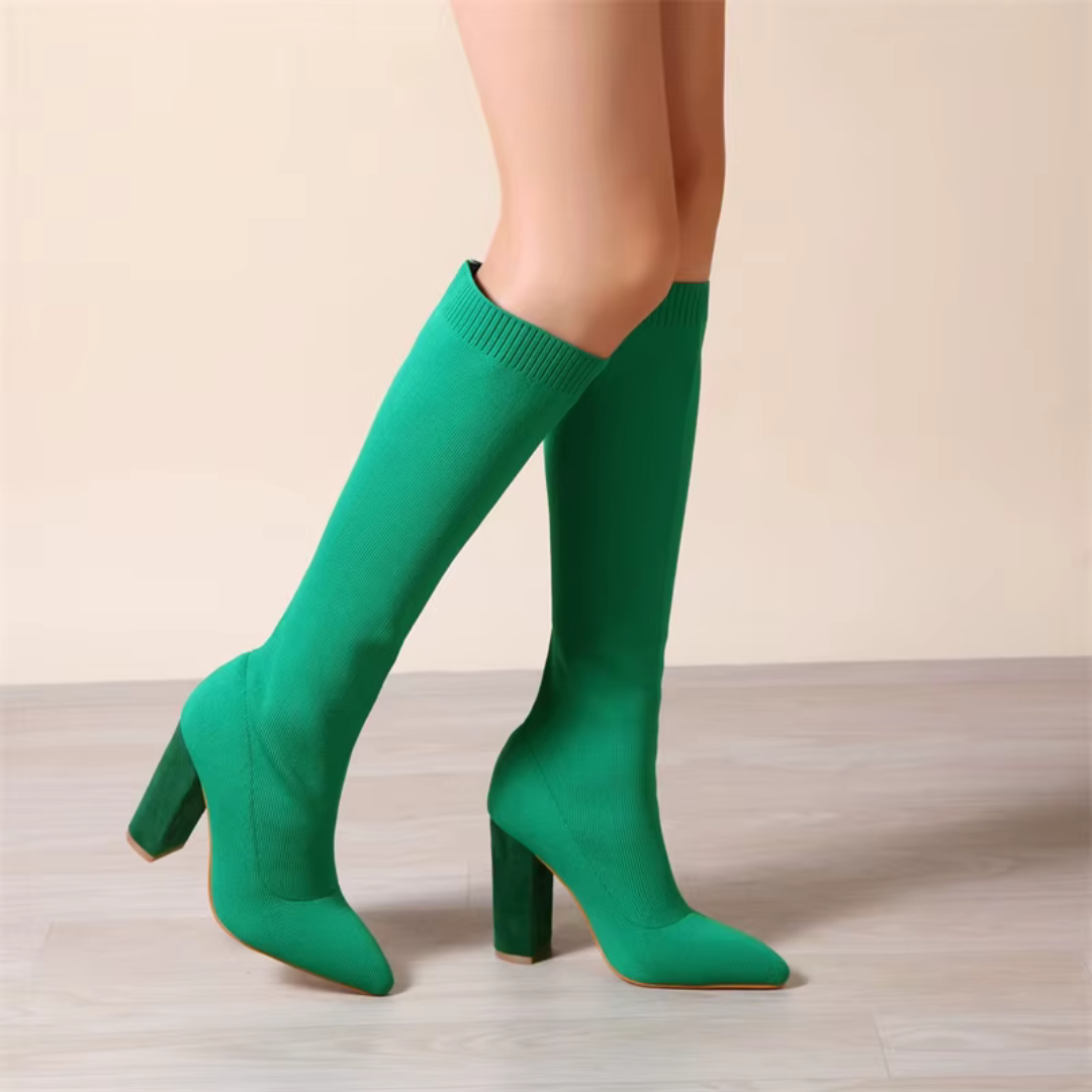 Sleek women's knee-high stretch boots. Comfortable slip-on design with a modern block heel.