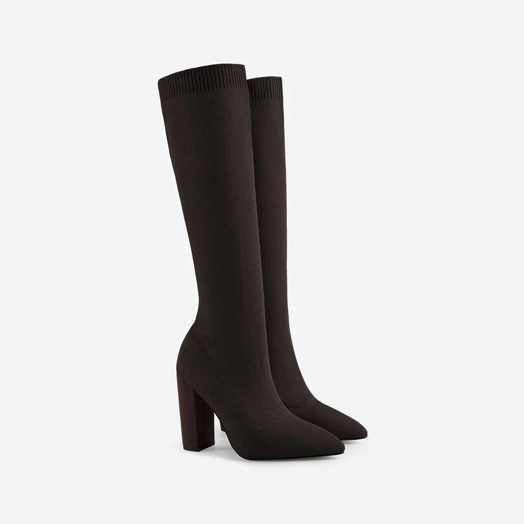 Elegant women's knee-high stretch boots. Features a sleek design and a stable modern block heel.