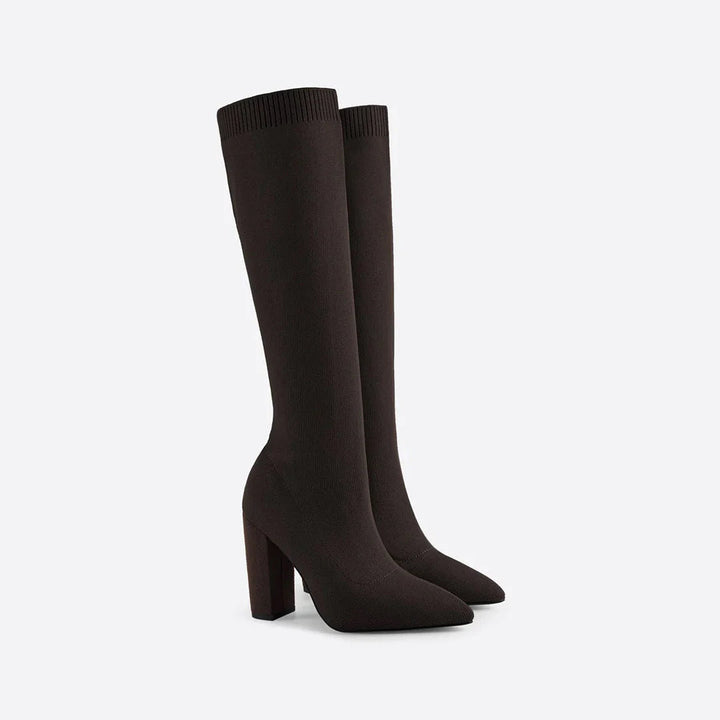 Elegant women's knee-high stretch boots. Features a sleek design and a stable modern block heel.