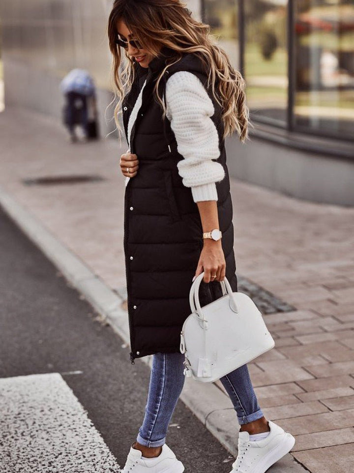 Aurora women's knee-length quilted vest, a fashionable sleeveless jacket for winter outerwear.