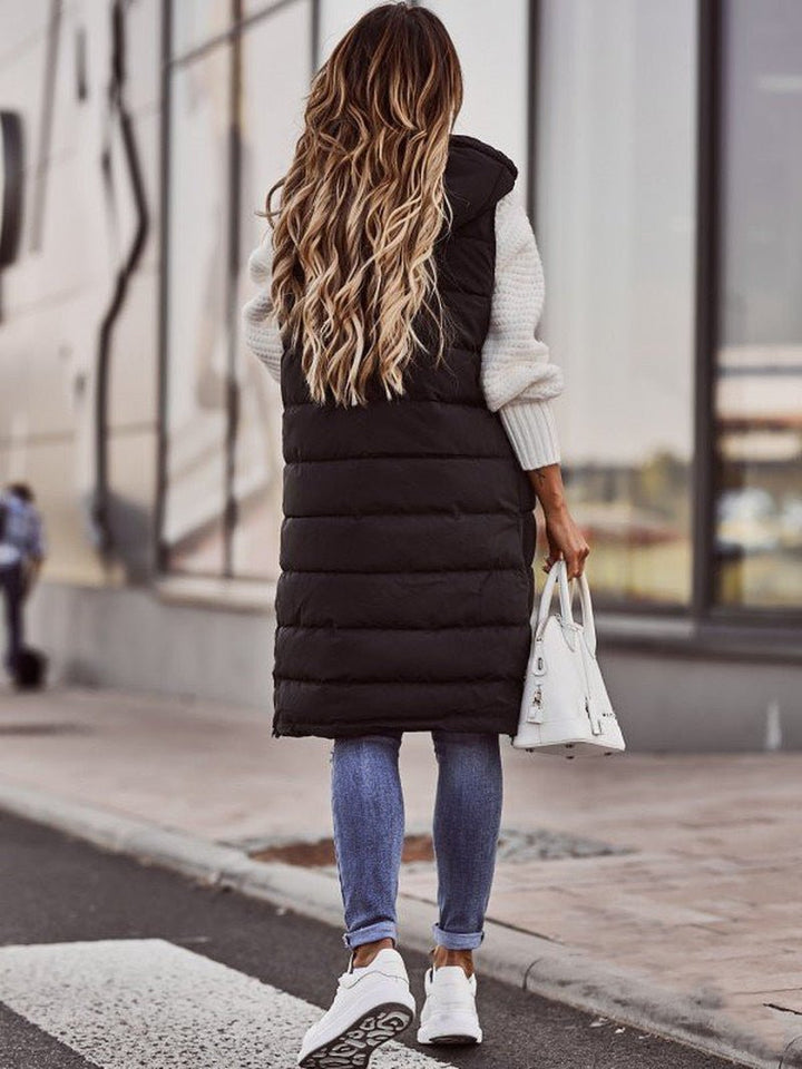 Stylish women's knee-length quilted vest bodywarmer, great for versatile winter fashion.