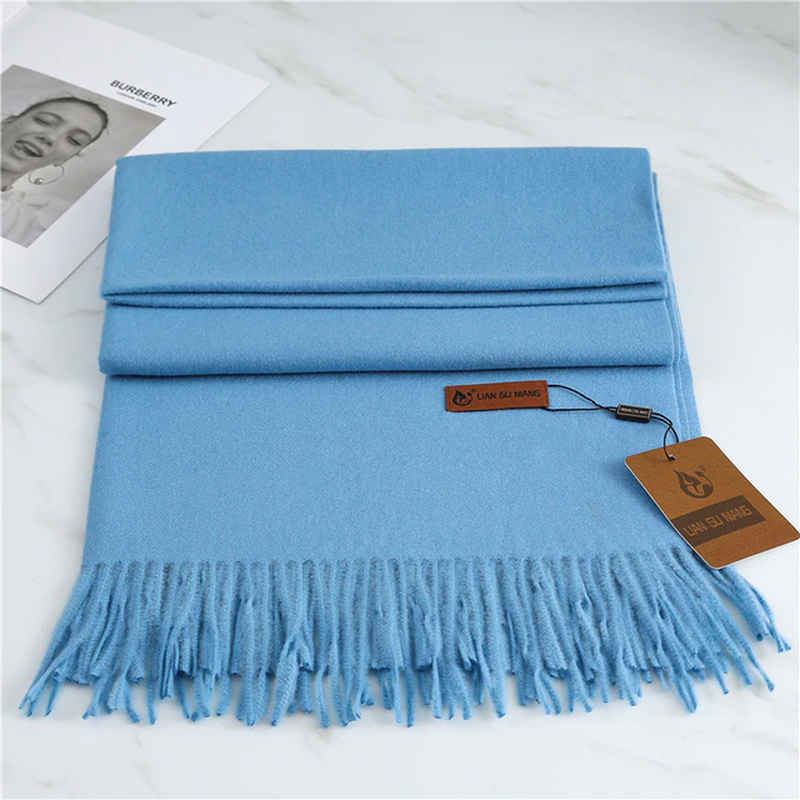 Cozy Krystal Cashmere tasseled scarf, an elegant and warm fall winter fashion accessory.