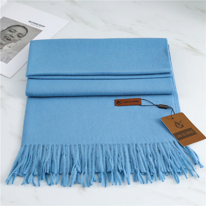 Cozy Krystal Cashmere tasseled scarf, an elegant and warm fall winter fashion accessory.