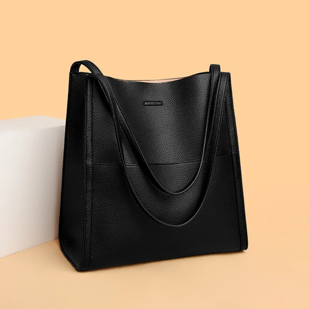 Women's large leather tote handbag with spacious interior, perfect for work documents & essentials.