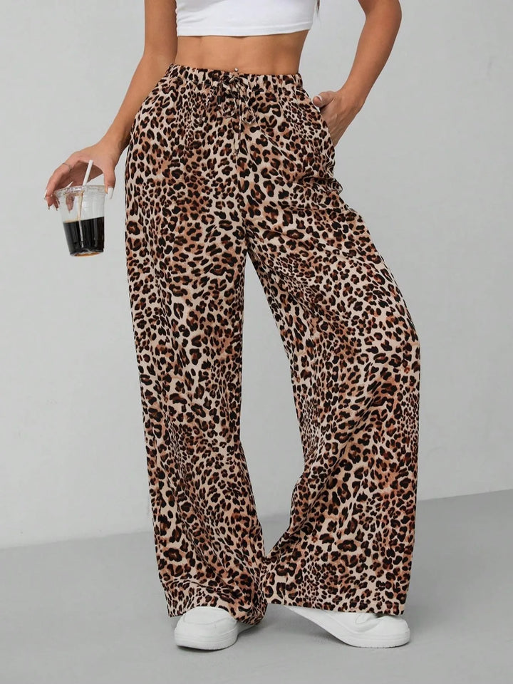 Women's leopard print wide leg pants with drawstring waist, relaxed fit for summer fashion.