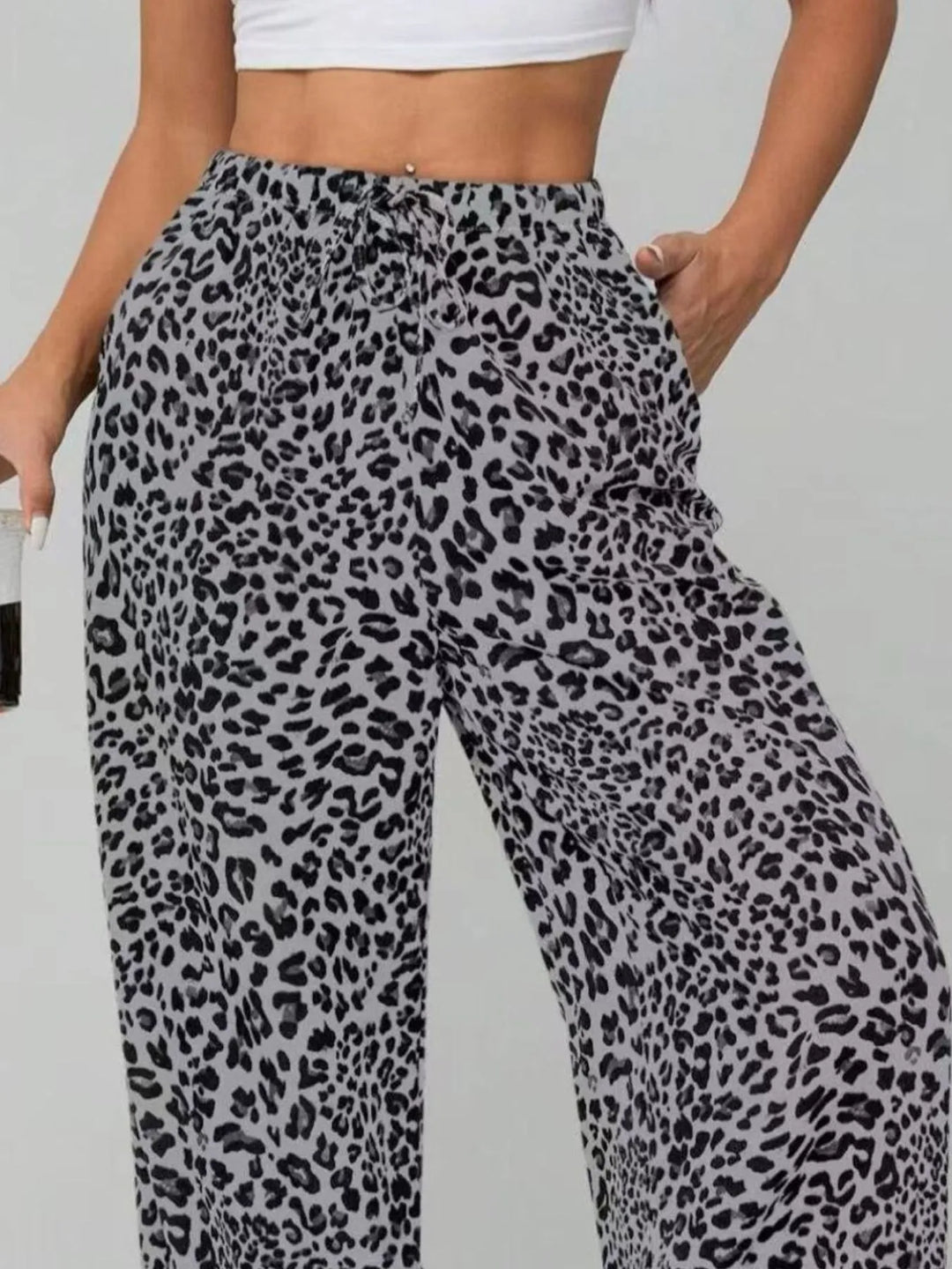 Comfortable relaxed fit women's leopard print wide leg pants with drawstring, perfect for stylish summer wear.