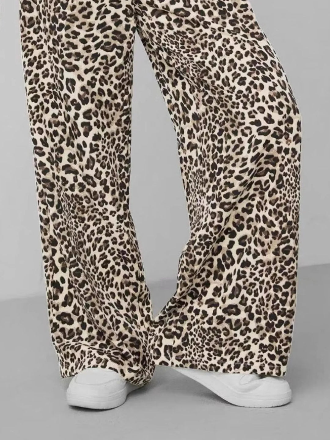 Chic women's apparel: leopard print wide leg pants with relaxed fit, perfect for stylish summer fashion.