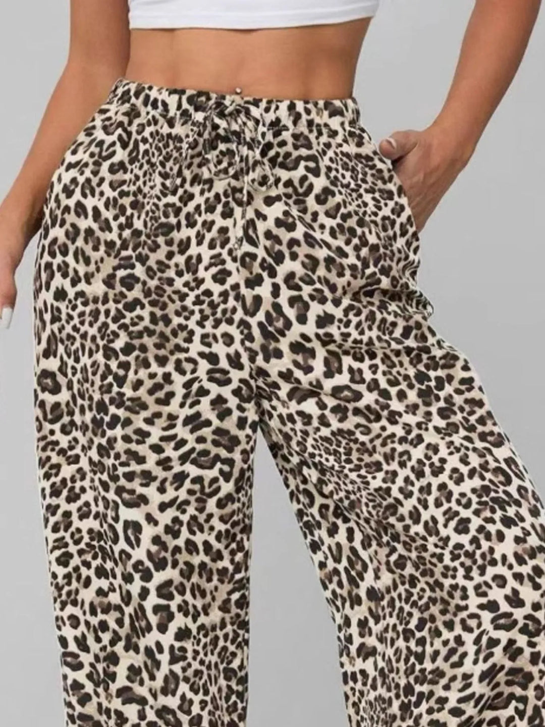 Comfortable & trendy women's leopard print wide leg pants, relaxed fit with drawstring waist for chic summer style.