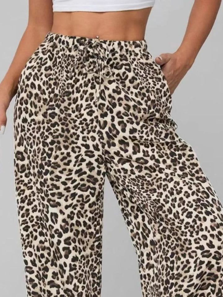 Comfortable & trendy women's leopard print wide leg pants, relaxed fit with drawstring waist for chic summer style.