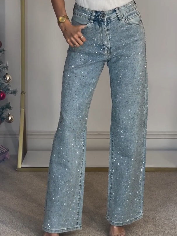 Women's light blue high waist straight leg jeans with glamorous diamanté embellishments. Trendy sparkle fashion.