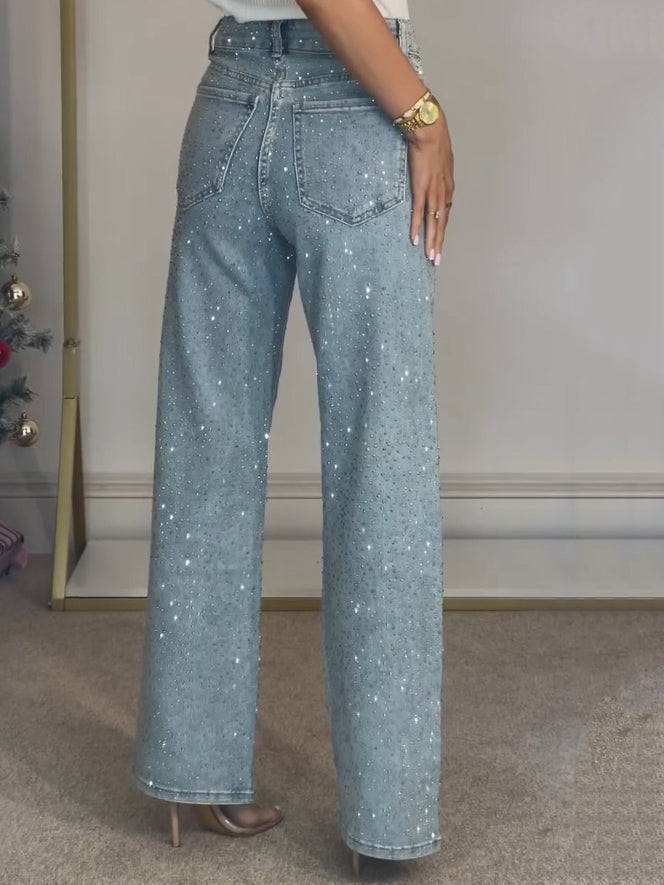 Glamorous high waist straight leg jeans for women, featuring dazzling diamanté embellishments. Fashionable bottoms.