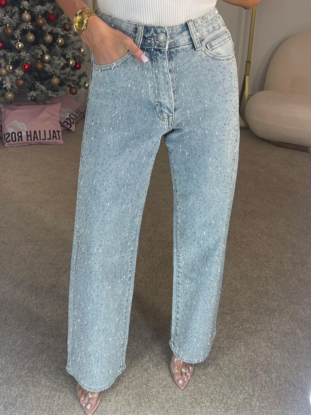 Light blue women's high waist straight leg jeans. Embellished with sparkling diamanté crystals. Trendy and chic.