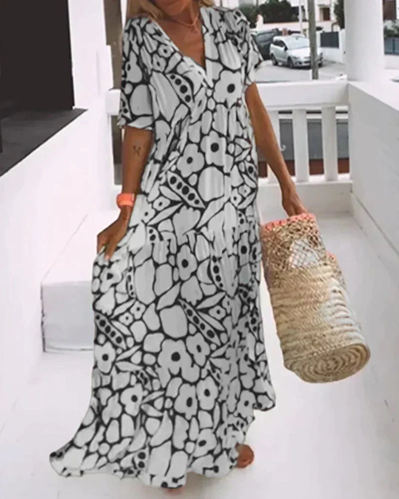 Elegant women's flowing maxi dress, a casual yet stylish vacation essential for spring and summer fashion.