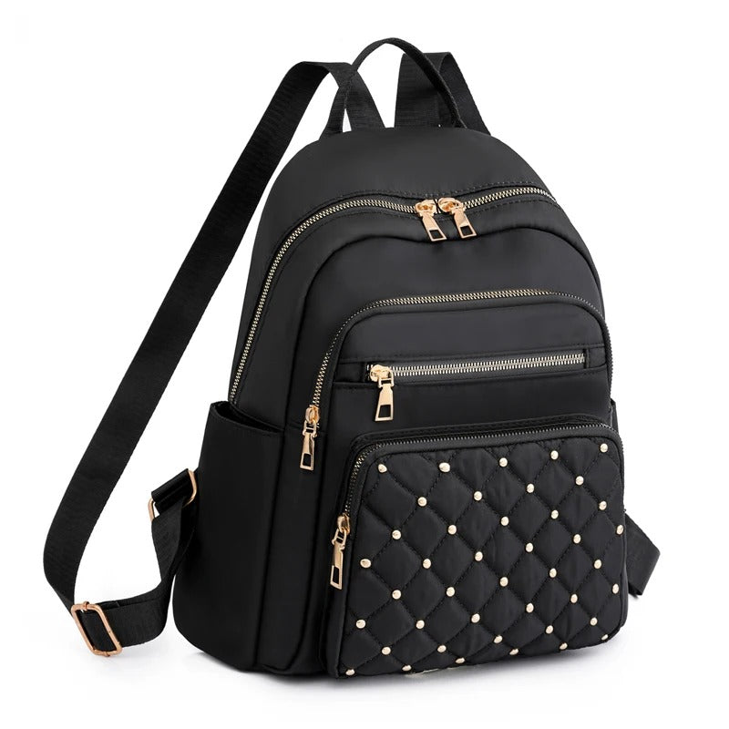 Women's lightweight nylon backpack for daily use. Water-resistant travel & school bag for comfort.